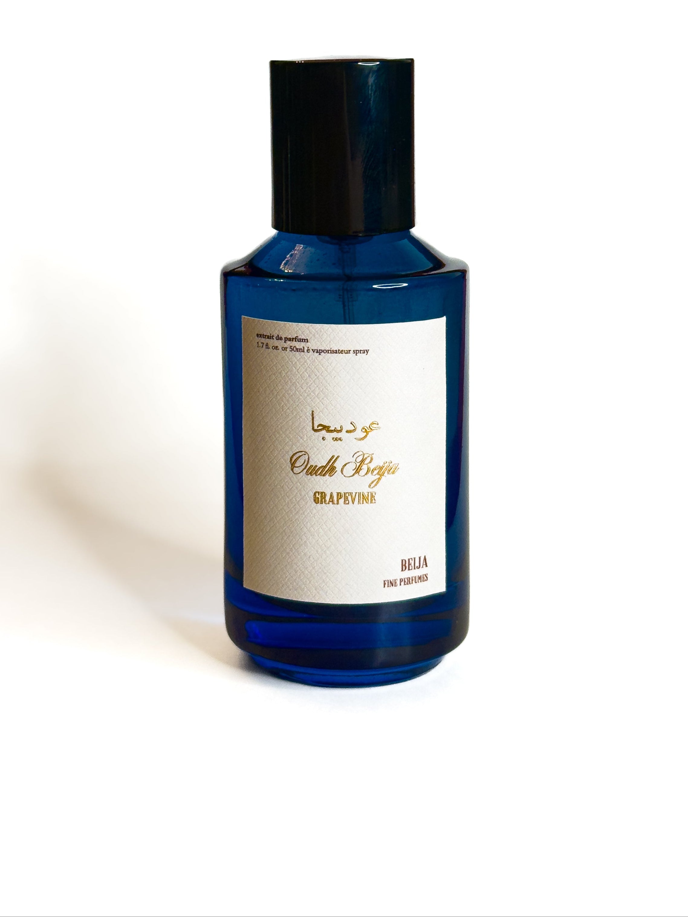 Blue bottle with a black cap on a white background Beija Fine Perfumes KSA Oud beija grapevine extrait de parfum