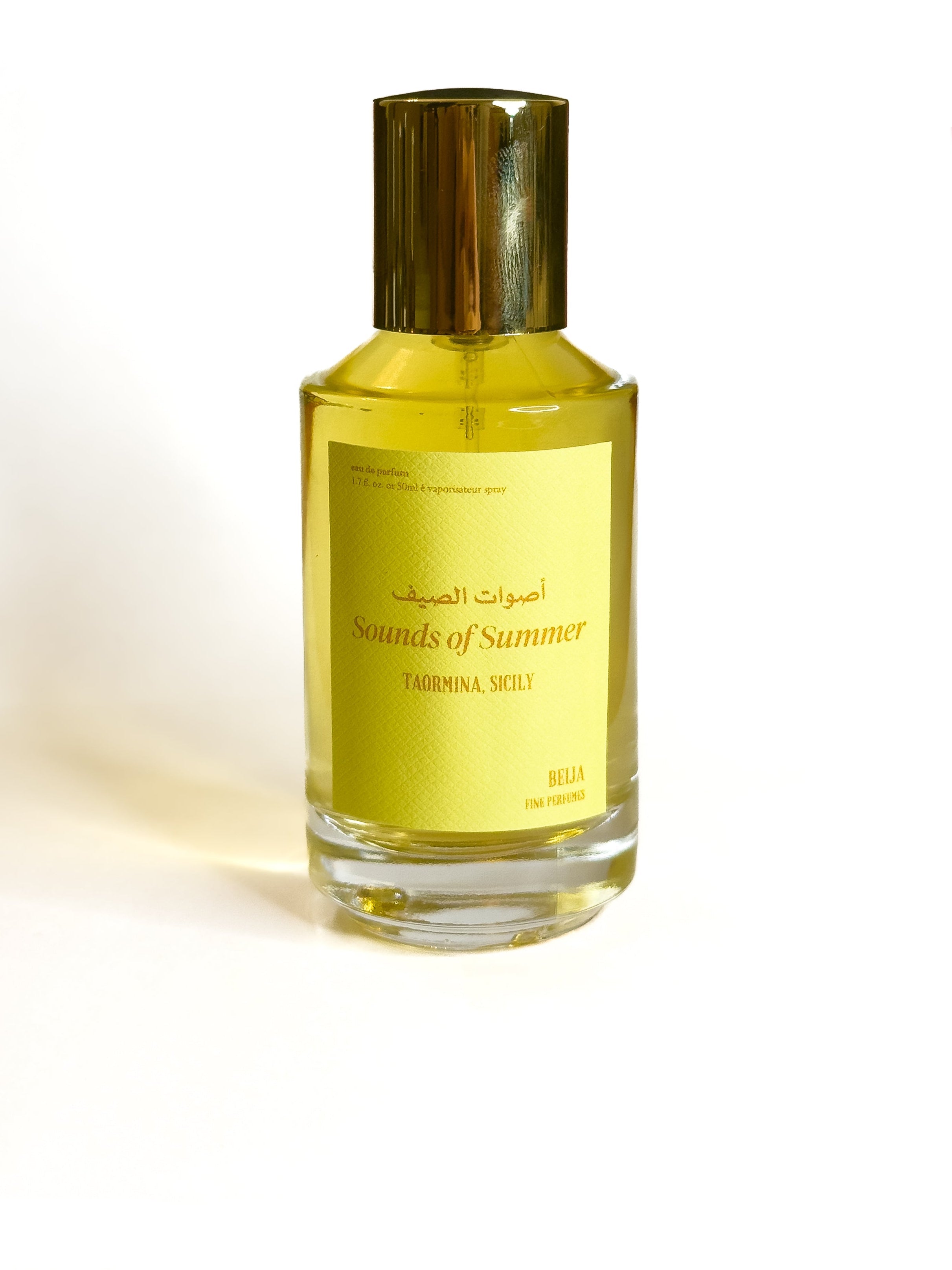 Perfume bottle with gold cap and yellow label on a white background Beija Fine Perfumes KSA Sounds of Summer Taormina Sicily Summer Perfume Eau de Parfum Niche