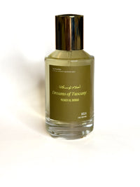 Perfume bottle labeled 'Dreams of Tuscany' on a white background